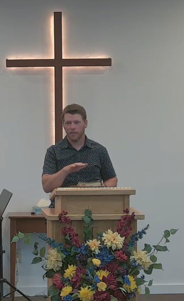 Pastor Eric Hartwell preaching at New Life Christian Church
